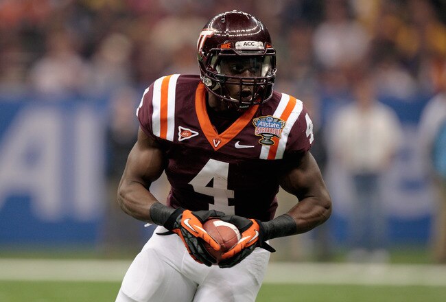 NEW ORLEANS, LA - JANUARY 03:  David Wilson #4 of the Virginia Tech Hokies runs the ball against the Michigan Wolverines during the Allstate Sugar Bowl at Mercedes-Benz Superdome on January 3, 2012 in New Orleans, Louisiana.  (Photo by Chris Graythen/Getty Images)