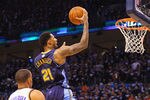 OKLAHOMA CITY, OK - APRIL 27: Wilson Chandler #21 of the Denver Nuggets drives to the basket against Nick Collison #4 of the Oklahoma City Thunder in Game Five of the Western Conference Quarterfinals in the 2011 NBA Playoffs on April 27, 2011 at the Ford Center in Oklahoma City, Oklahoma. NOTE TO USER: User expressly acknowledges and agrees that, by downloading and or using this photograph, User is consenting to the terms and conditions of the Getty Images License Agreement. (Photo by Dilip Vishwanat/Getty Images)