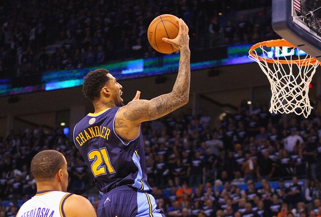 OKLAHOMA CITY, OK - APRIL 27: Wilson Chandler #21 of the Denver Nuggets drives to the basket against Nick Collison #4 of the Oklahoma City Thunder in Game Five of the Western Conference Quarterfinals in the 2011 NBA Playoffs on April 27, 2011 at the Ford Center in Oklahoma City, Oklahoma. NOTE TO USER: User expressly acknowledges and agrees that, by downloading and or using this photograph, User is consenting to the terms and conditions of the Getty Images License Agreement. (Photo by Dilip Vishwanat/Getty Images)