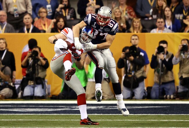 INDIANAPOLIS, IN - FEBRUARY 05:  Chase Blackburn #93 of the New York Giants intercepts a pass intended for Rob Gronkowski #87 of the New England Patriots in the second half during Super Bowl XLVI at Lucas Oil Stadium on February 5, 2012 in Indianapolis, Indiana.  (Photo by Win McNamee/Getty Images)