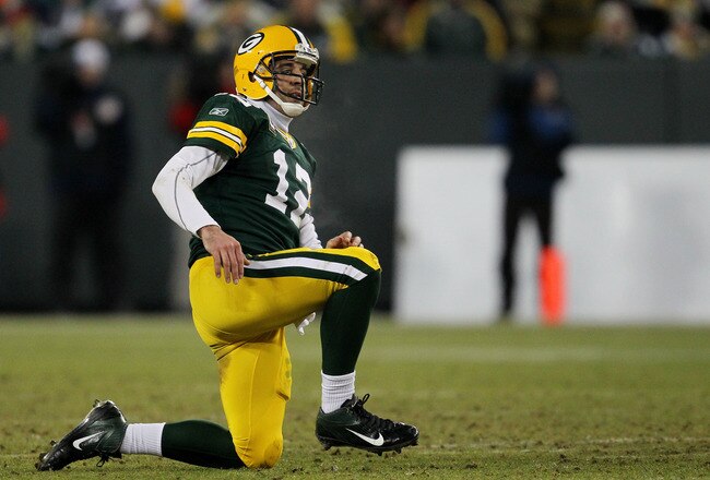 GREEN BAY, WI - JANUARY 15:  Aaron Rodgers #12 of the Green Bay Packers looks on in the third quarter against the New York Giants during their NFC Divisional playoff game at Lambeau Field on January 15, 2012 in Green Bay, Wisconsin.  (Photo by Jonathan Daniel/Getty Images)