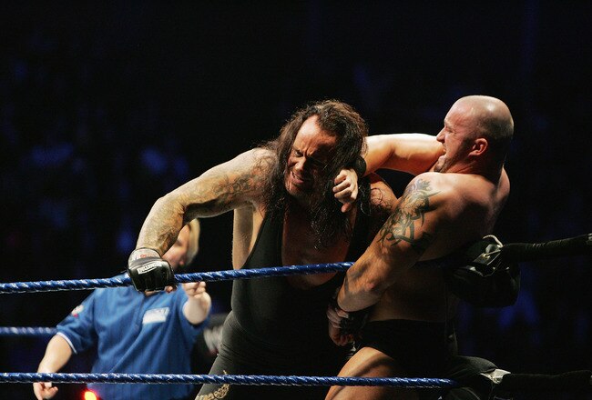 SYDNEY, AUSTRALIA - JUNE 15:  The Undertaker (L) pushes Bam Neely into the corner during WWE Smackdown at Acer Arena on June 15, 2008 in Sydney, Australia.  (Photo by Gaye Gerard/Getty Images)