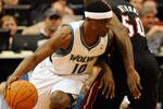 MINNEAPOLIS, MN - APRIL 1: Jonny Flynn #10 of the Minnesota Timberwolves dribbles around Joel Anthony #50 of the Miami Heat during a basketball game at Target Center on April 1, 2011 in Minneapolis, Minnesota. NOTE TO USER: User expressly acknowledges and agrees that, by downloading and or using this Photograph, user is consenting to the terms and conditions of the Getty Images License Agreement.  (Photo by Hannah Foslien /Getty Images)