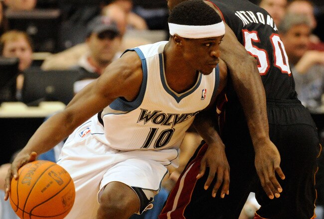 MINNEAPOLIS, MN - APRIL 1: Jonny Flynn #10 of the Minnesota Timberwolves dribbles around Joel Anthony #50 of the Miami Heat during a basketball game at Target Center on April 1, 2011 in Minneapolis, Minnesota. NOTE TO USER: User expressly acknowledges and agrees that, by downloading and or using this Photograph, user is consenting to the terms and conditions of the Getty Images License Agreement.  (Photo by Hannah Foslien /Getty Images)