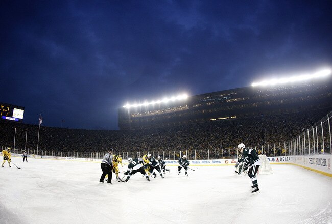 ANN ARBOR, MI - DECEMBER 11: A third period faceoff takes place between the Michigan Wolverines and Michigan State Spartans during thier outdoor game at Michigan Stadium on December 11, 2010 in Ann Arbor, Michigan.  (Photo by Gregory Shamus/Getty Images)