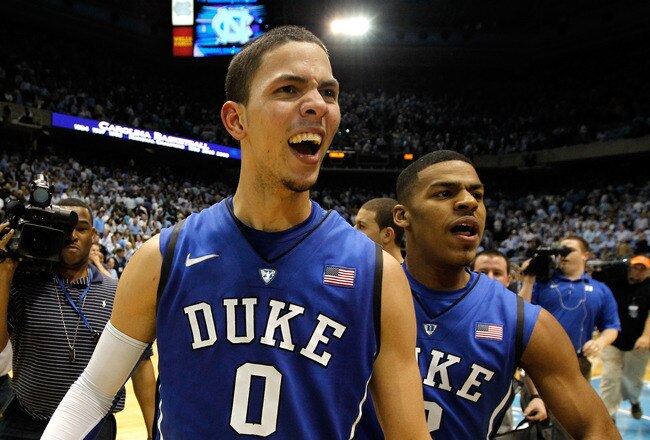 CHAPEL HILL, NC - FEBRUARY 08:  Austin Rivers #0 of the Duke Blue Devils celebrates with teammate Quinn Cook #2 after hitting a game-winning 3 pointer to defeat the North Carolina Tar Heels 85-84 during their game at the Dean Smith Center on February 8, 2012 in Chapel Hill, North Carolina.  (Photo by Streeter Lecka/Getty Images)