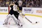 BOSTON, MA - JANUARY 31:  Tim Thomas #30 of the Boston Bruins clears the puck in the second period against the Ottawa Senators on January 31, 2012 at TD Garden in Boston, Massachusetts.  (Photo by Elsa/Getty Images)