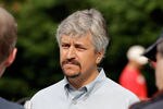 BALTIMORE, MD - MAY 20:  Steve Asmussen, the trainer of Preakness entrant Astrology, talks with the media outside the stakes barn at Pimlico Race Course on May 20, 2011 in Baltimore, Maryland. The 136th running of the Preakness Stakes will be run on May 21.  (Photo by Rob Carr/Getty Images)