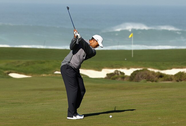 PEBBLE BEACH, CA - FEBRUARY 08:  Tiger Woods hits an approach shot during a practice round for the AT&T Pebble Beach National Pro-Am at the Monterey Peninsula Country Club on February 8, 2012 in Pebble Beach, California.  (Photo by Ezra Shaw/Getty Images)