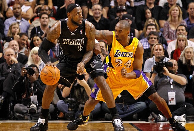 MIAMI, FL - JANUARY 19:  LeBron James #6 of the Miami Heat is guarded by Kobe Bryant #24 of the Los Angeles Lakers during a game  at American Airlines Arena on January 19, 2012 in Miami, Florida. NOTE TO USER: User expressly acknowledges and agrees that, by downloading and/or using this Photograph, User is consenting to the terms and conditions of the Getty Images License Agreement.  (Photo by Mike Ehrmann/Getty Images)