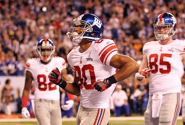 INDIANAPOLIS, IN - FEBRUARY 05:  Victor Cruz #80 of the New York Giants celebrates in the end zone after catching a two yard touchdown pass from Eli Manning #10 in the first quarter against the New England Patriots during Super Bowl XLVI at Lucas Oil Stadium on February 5, 2012 in Indianapolis, Indiana.  (Photo by Jamie Squire/Getty Images)