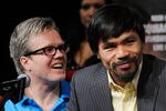 LAS VEGAS, NV - NOVEMBER 09:  Trainer Freddie Roach (L) and boxer Manny Pacquiao appear during the final news conference for Pacquiao's bout with Juan Manuel Marquez at the MGM Grand Hotel/Casino November 9, 2011 in Las Vegas, Nevada. Pacquiao will defend his WBO welterweight title against Marquez when the two meet in the ring for the third time on November 12 in Las Vegas.  (Photo by Ethan Miller/Getty Images)
