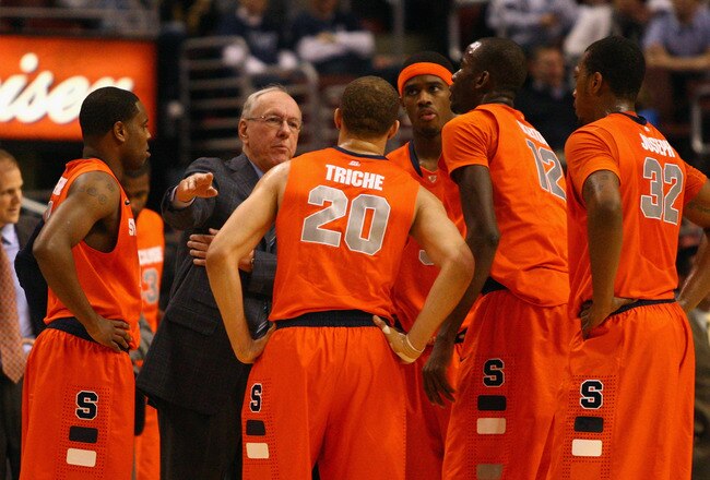 PHILADELPHIA, PA - JANUARY 11:  Head coach Jim Boeheim of the Syracuse Orange talks with (in uniform L-R) Scoop Jardine #11, Brandon Triche #20, C.J. Fair #5, Baye Moussa Keita #12 and Kris Joseph #32 during a timeout against the Villanova Wildcats at the Wells Fargo Center on January 11, 2012 in Philadelphia, Pennsylvania.  (Photo by Chris Chambers/Getty Images)