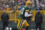 GREEN BAY, WI - JANUARY 01:  Matt Flynn #10 of the Green Bay Packers rolls out to look for a receiver against the Detroit Lions at Lambeau Field on January 1, 2012 in Green Bay, Wisconsin. The Packers defeated the Lions 45-41.  (Photo by Jonathan Daniel/Getty Images)