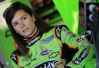 DAYTONA BEACH, FL - JANUARY 12:  Danica Patrick, driver of the #10 GoDaddy.com Chevrolet, stands in the garage area during Daytona Preseason Thunder at Daytona International Speedway on January 12, 2012 in Daytona Beach, Florida.  (Photo by Jared C. Tilton/Getty Images for NASCAR)
