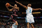NEW ORLEANS, LA - FEBRUARY 08:  Derrick Rose #1 of the Chicago Bulls shoots the ball over Jarrett Jack #2 of the New Orleans Hornets at New Orleans Arena on February 8, 2012 in New Orleans, Louisiana.  NOTE TO USER: User expressly acknowledges and agrees that, by downloading and or using this photograph, User is consenting to the terms and conditions of the Getty Images License Agreement.  (Photo by Chris Graythen/Getty Images)