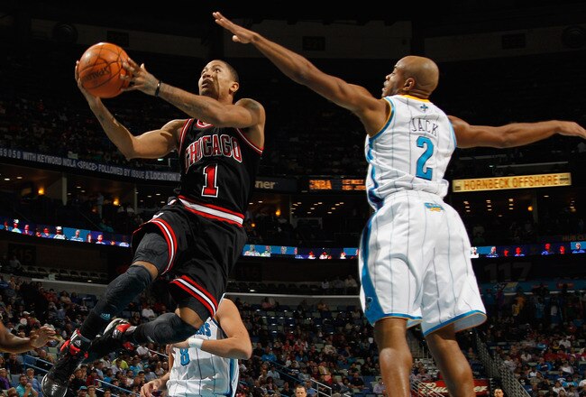 NEW ORLEANS, LA - FEBRUARY 08:  Derrick Rose #1 of the Chicago Bulls shoots the ball over Jarrett Jack #2 of the New Orleans Hornets at New Orleans Arena on February 8, 2012 in New Orleans, Louisiana.  NOTE TO USER: User expressly acknowledges and agrees that, by downloading and or using this photograph, User is consenting to the terms and conditions of the Getty Images License Agreement.  (Photo by Chris Graythen/Getty Images)