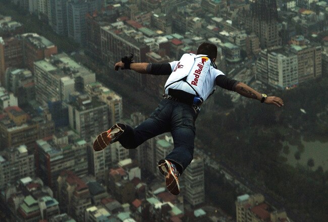 TAIPEI, TAIWAN - DECEMBER 12: (EDITORIAL USE ONLY - NO SALES, NO ARCHIVING) In this handout provided by Euro-Newsroom, a 38-year-old Felix Baumgartner, Austrian base jumper, makes a jump off the world's tallest completed building, the 508-meter high Taipei 101 Tower, December 12, 2007 in Taipei,Taiwan.   (Photo by Joerg Mitter/Euro-Newsroom via Getty Images)