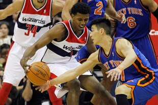 WASHINGTON, DC - FEBRUARY 08:  Nick Young #1 of the Washington Wizards and Jeremy Lin #17 of the New York Knicks go after a loose ball during the first half at Verizon Center on February 8, 2012 in Washington, DC. NOTE TO USER: User expressly acknowledges and agrees that, by downloading and or using this photograph, User is consenting to the terms and conditions of the Getty Images License Agreement.  (Photo by Rob Carr/Getty Images)