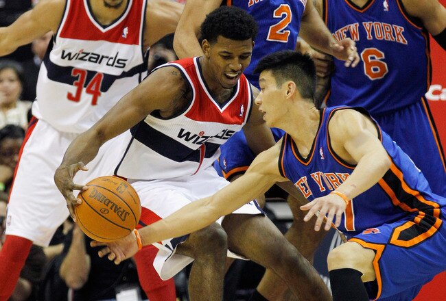 WASHINGTON, DC - FEBRUARY 08:  Nick Young #1 of the Washington Wizards and Jeremy Lin #17 of the New York Knicks go after a loose ball during the first half at Verizon Center on February 8, 2012 in Washington, DC. NOTE TO USER: User expressly acknowledges and agrees that, by downloading and or using this photograph, User is consenting to the terms and conditions of the Getty Images License Agreement.  (Photo by Rob Carr/Getty Images)