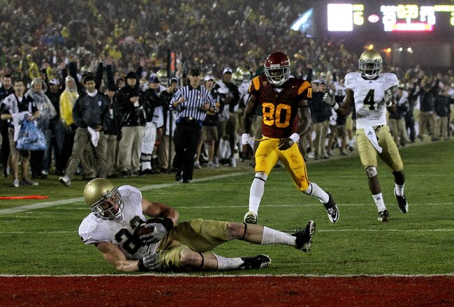 LOS ANGELES - NOVEMBER 27:  Safety Harrison Smith #22 of the Notre Dame Fighting Irish comes down with the interception onf the one yard line to end the final drive in the final minute by the USC Trojans at the Los Angeles Memorial Coliseum on November 27, 2010 in Los Angeles, California.  Notre Dame won 20-16.  (Photo by Stephen Dunn/Getty Images)
