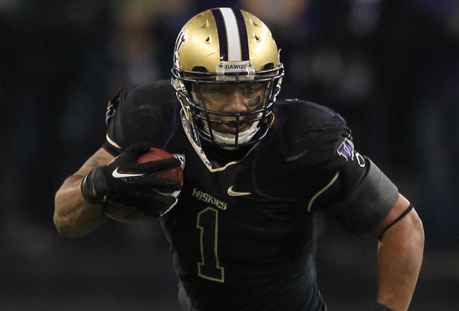 SEATTLE - NOVEMBER 05:  Running back Chris Polk #1 of the Washington Huskies rushes against the Oregon Ducks on November 5, 2011 at Husky Stadium in Seattle, Washington. Oregon won 34-17. (Photo by Otto Greule Jr/Getty Images)