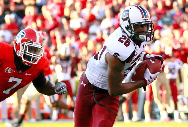 ATHENS, GA - SEPTEMBER 10:  Antonio Allen #26 of the South Carolina Gamecocks intercepts a pass for a touchdown that was intended for Orson Charles #7 of the Georgia Bulldogs at Sanford Stadium on September 10, 2011 in Athens, Georgia.  (Photo by Kevin C. Cox/Getty Images)