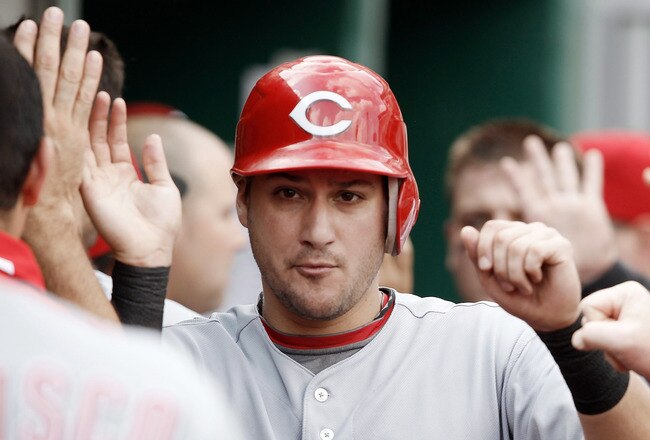 PITTSBURGH, PA - SEPTEMBER 25:  Paul Janish #7 of the Cincinnati Reds is congratulated by teammates in the dugout after scoring against the Pittsburgh Pirates in the 6th inning during the game on September 25, 2011 at PNC Park in Pittsburgh, Pennsylvania.  (Photo by Jared Wickerham/Getty Images)