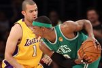 LOS ANGELES, CA - JUNE 17:  Rajon Rondo #9 of the Boston Celtics looks looks to move the ball as he is guarded by Jordan Farmar #1 of the Los Angeles Lakers in Game Seven of the 2010 NBA Finals at Staples Center on June 17, 2010 in Los Angeles, California.  NOTE TO USER: User expressly acknowledges and agrees that, by downloading and/or using this Photograph, user is consenting to the terms and conditions of the Getty Images License Agreement.  (Photo by Christian Petersen/Getty Images)