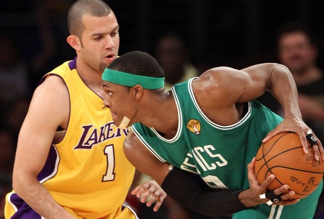 LOS ANGELES, CA - JUNE 17:  Rajon Rondo #9 of the Boston Celtics looks looks to move the ball as he is guarded by Jordan Farmar #1 of the Los Angeles Lakers in Game Seven of the 2010 NBA Finals at Staples Center on June 17, 2010 in Los Angeles, California.  NOTE TO USER: User expressly acknowledges and agrees that, by downloading and/or using this Photograph, user is consenting to the terms and conditions of the Getty Images License Agreement.  (Photo by Christian Petersen/Getty Images)