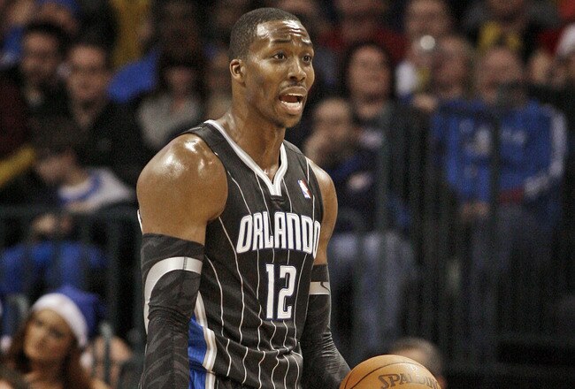 OKLAHOMA CITY, OK - DECEMBER 25:  Dwight Howard #12 of the Orlando Magic questions a call during the NBA season opening game against the Oklahoma City Thunder December 25, 2011 at the Chesapeake Energy Arena in Oklahoma City, Oklahoma.  Oklahoma City defeated Orlando 97-89. NOTE TO USER: User expressly acknowledges and agrees that, by downloading and or using this Photograph, user is consenting to the terms and conditions of the Getty Images License Agreement.  (Photo by Brett Deering/Getty Images)