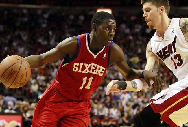 MIAMI, FL - MARCH 25:  Forward Mike Miller #13 of the Miami Heat defends against Guard Jrue Holiday #11 of the Philadelphia Sixers at American Airlines Arena on March 25, 2011 in Miami, Florida. NOTE TO USER: User expressly acknowledges and agrees that, by downloading and/or using this Photograph, User is consenting to the terms and conditions of the Getty Images License Agreement.  (Photo by Marc Serota/Getty Images)
