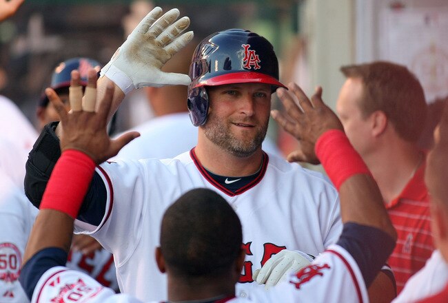 ANAHEIM, CA - JULY 03:  Russell Branyan #39 of the Los Angeles Angels of Anaheim celebrates with teammates in the dugout after hitting a two-run home run in the bottom of the 7th inning against the Los Angeles Dodgers during their MLB game at Angel Stadium of Anaheim on July 3, 2011 in Anaheim, California. The Angels defeated Dodgers 3-1.  (Photo by Victor Decolongon/Getty Images)