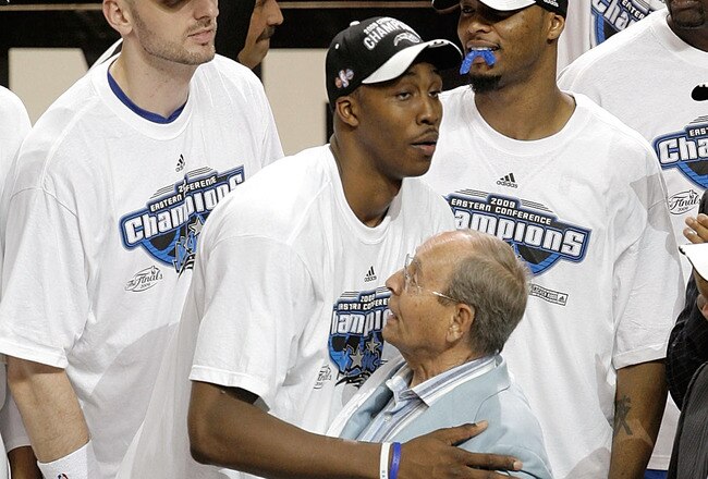 ORLANDO, FL - MAY 30: Dwight Howard #12 of the Orlando Magic hugs Orlando Magic owner Richard DeVos on the court after defeating the Cleveland Cavaliers of the Orlando Magic in Game Six of the Eastern Conference Finals during the 2009 Playoffs at Amway Arena on May 30, 2009 in Orlando, Florida. NOTE TO USER: User expressly acknowledges and agrees that, by downloading and or using this photograph, User is consenting to the terms and conditions of the Getty Images License Agreement  (Photo by Doug Benc/Getty Images)