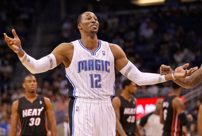 ORLANDO, FL - DECEMBER 21: Dwight Howard #12 of the Orlando Magic argues a call during a preseason game against the Miami Heat at Amway Center on December 21, 2011 in Orlando, Florida. NOTE TO USER: User expressly acknowledges and agrees that, by downloading and/or using this Photograph, User is consenting to the terms and conditions of the Getty Images License Agreement.  (Photo by Mike Ehrmann/Getty Images)