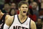 NEWARK, NJ - APRIL 03:  Brook Lopez #11 of the New Jersey Nets reacts against the Miami Heat at the Prudential Center on April 3, 2011 in Newark, New Jersey.The Heat defeated the Nets 108-94.NOTE TO USER: User expressly acknowledges and agrees that, by downloading and/or using this Photograph, user is consenting to the terms and conditions of the Getty Images License Agreement.  (Photo by Jim McIsaac/Getty Images)