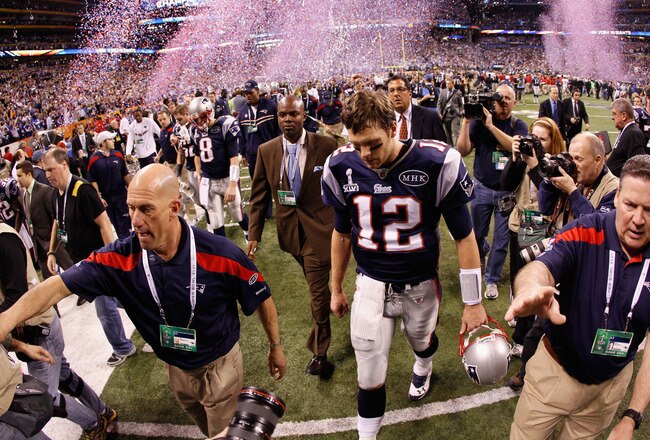 INDIANAPOLIS, IN - FEBRUARY 05:  Tom Brady #12 of the New England Patriots walks off the field after losing to the New York Giants by a score of 21-17 in Super Bowl XLVI at Lucas Oil Stadium on February 5, 2012 in Indianapolis, Indiana.  (Photo by Rob Carr/Getty Images)