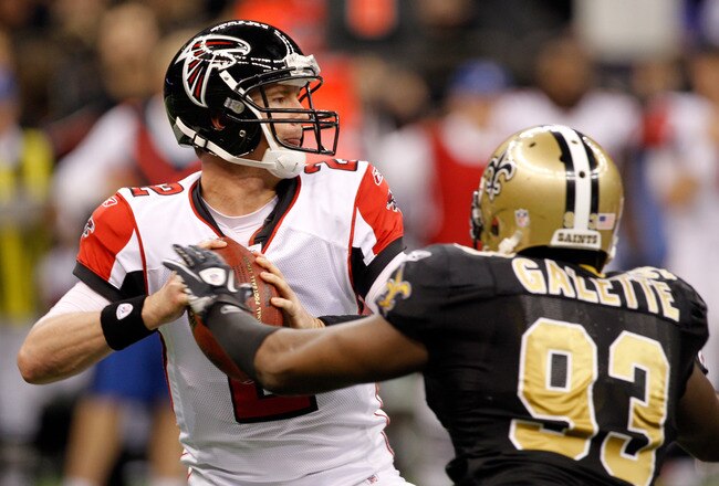 NEW ORLEANS, LA - DECEMBER 26:  Quarterback Matt Ryan #2 of the Atlanta Falcons looks to pass as defensive end Junior Galette #93 of the New Orleans Saints rushes in during the second quarter at the Mercedes-Benz Superdome on December 26, 2011 in New Orleans, Louisiana.  (Photo by Chris Graythen/Getty Images)
