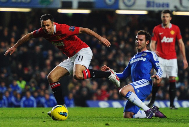 LONDON, ENGLAND - FEBRUARY 05:  Ryan Giggs of Manchester United beats Juan Mata of Chelsea during the Barclays Premier League match between Chelsea and Manchester United at Stamford Bridge on February 5, 2012 in London, England.  (Photo by Mike Hewitt/Getty Images)