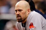 ST. PETERSBURG, FL - JUNE 15:  Infielder Kevin Youkilis #20 of the Boston Red Sox watches his team from the dugout against the Tampa Bay Rays during the game at Tropicana Field on June 15, 2011 in St. Petersburg, Florida.  (Photo by J. Meric/Getty Images)