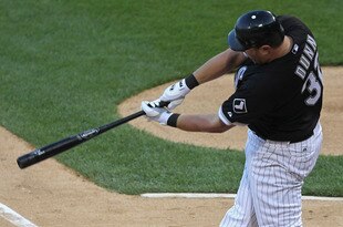 CHICAGO, IL - JULY 26: Adam Dunn #32 of the Chicago White Sox hits a two-run home run in the 1st inning against the Detroit Tigers at U.S. Cellular Field on July 26, 2011 in Chicago, Illinois. (Photo by Jonathan Daniel/Getty Images)