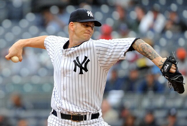 NEW YORK, NY - SEPTEMBER 07: A.J. Burnett #34 of the New York Yankees throws a pitch during the top of the fourth inning against the Baltimore Orioles on September 7, 2011 at Yankee Stadium in the Bronx borough of New York City. (Photo by Christopher Pasatieri/Getty Images)