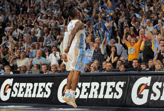 DENVER, CO - APRIL 25:  J.R. Smith #5 of the Denver Nuggets excites the fans as he celebrates making a three point shot against the Oklahoma City Thunder in Game Four of the Western Conference Quarterfinals in the 2011 NBA Playoffs on April 24, 2011 at the Pepsi Center in Denver, Colorado. NOTE TO USER: User expressly acknowledges and agrees that, by downloading and or using this photograph, User is consenting to the terms and conditions of the Getty Images License Agreement.  (Photo by Doug Pensinger/Getty Images)