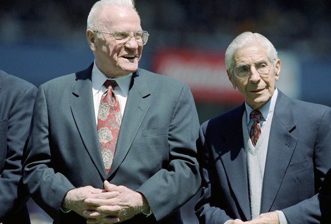 BRONX, NY - APRIL 25:  (L-R) Former New York Yankees Hank Bauer land Phil Rizzuto look on prior to the game between the Toronto Blue Jays and the New York Yankees on Joe DiMaggio Day  at Yankee Stadium on April 25, 1999 in Bronx, New York. The Yankees defeated the Blue Jays 4-3. (Photo by M. Davild Leeds/Getty Images)