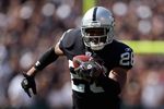 OAKLAND, CA - SEPTEMBER 09:  Stanford Routt #26 of the Oakland Raiders carries the ball against the Detroit Lions during the NFL game on September 9, 2007 at McAfee Coliseum in Oakland, California. The Lions won 36-21. (Photo by Jed Jacobsohn/Getty Images)