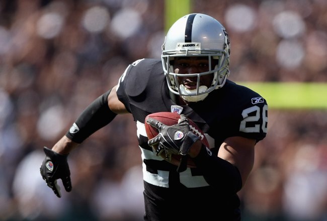 OAKLAND, CA - SEPTEMBER 09:  Stanford Routt #26 of the Oakland Raiders carries the ball against the Detroit Lions during the NFL game on September 9, 2007 at McAfee Coliseum in Oakland, California. The Lions won 36-21. (Photo by Jed Jacobsohn/Getty Images)