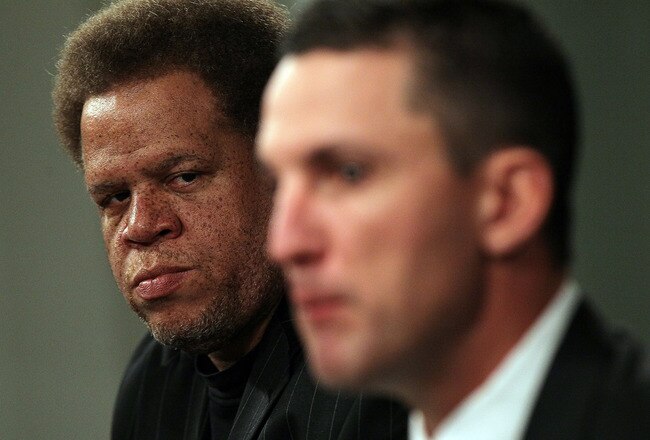 ALAMEDA, CA - JANUARY 30:  Raiders general manager Reggie McKenzie (L) looks on as new Oakland Raiders head coach Dennis Allen (R) speaks during a press conference on January 30, 2012 in Alameda, California. Dennis Allen was introduced as the new coach of the Oakland Raiders, replacing Hue Jackson who was fired after one season.  (Photo by Justin Sullivan/Getty Images)