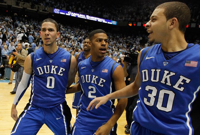 CHAPEL HILL, NC - FEBRUARY 08:  Austin Rivers #0 of the Duke Blue Devils celebrates with teammates Seth Curry #30 and Quinn Cook #2 after hitting a game-winning 3 pointer to defeat the North Carolina Tar Heels 85-84 during their game at the Dean Smith Center on February 8, 2012 in Chapel Hill, North Carolina.  (Photo by Streeter Lecka/Getty Images)