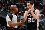 ATLANTA, GA - APRIL 05:  Manu Ginobili #20 of the San Antonio Spurs converses with referee Sean Wright #65 against the Atlanta Hawks at Philips Arena on April 5, 2011 in Atlanta, Georgia.  NOTE TO USER: User expressly acknowledges and agrees that, by downloading and/or using this Photograph, user is consenting to the terms and conditions of the Getty Images License Agreement.  (Photo by Kevin C. Cox/Getty Images)