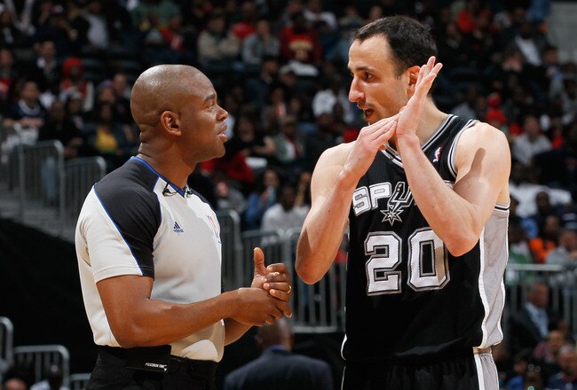 with referee Sean Wright #65 ag...